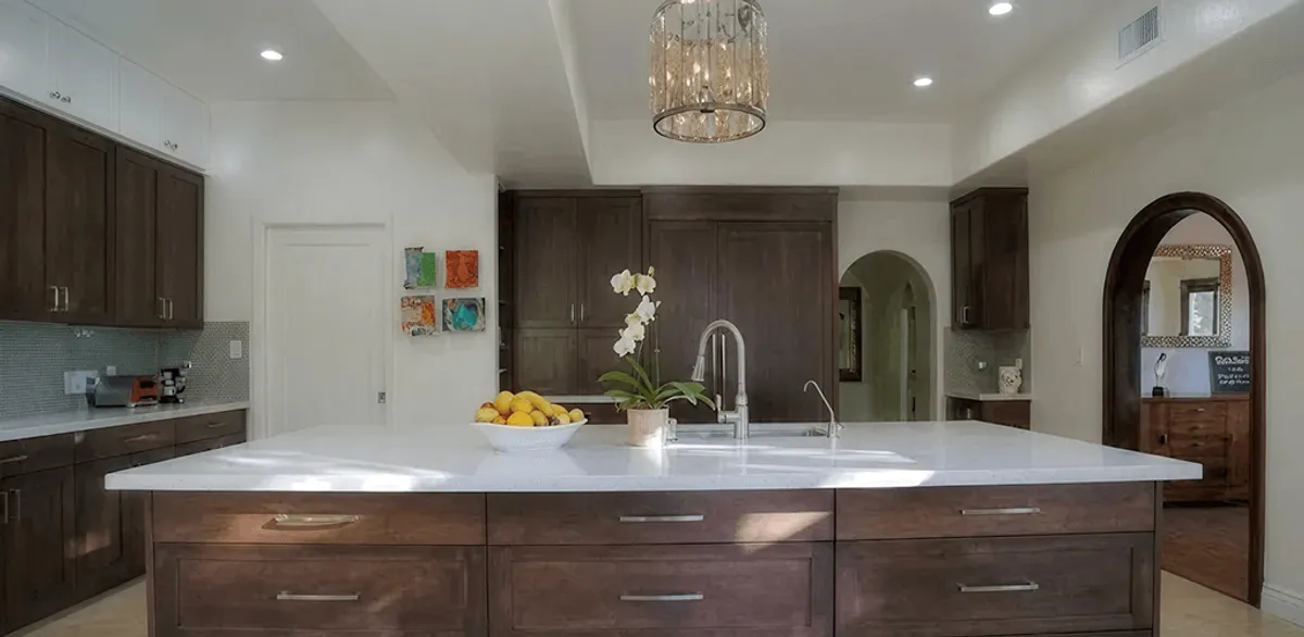 Cabinet refacing project with updated kitchen cabinets and island in Jackson, MS